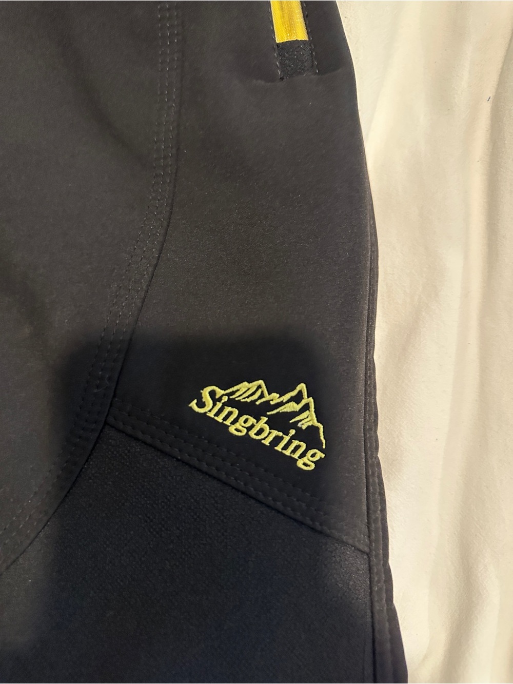 Singbring Black Softshell Jacket with Yellow Logo